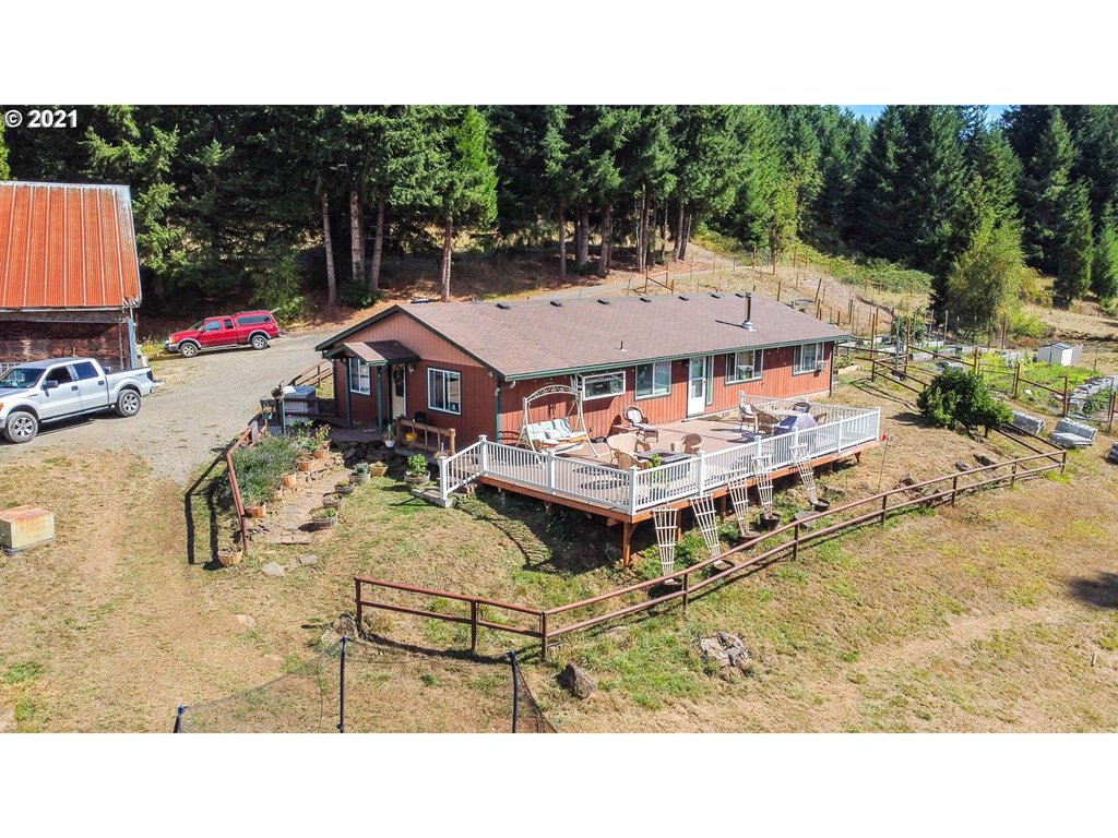 72010 London Road Cottage Grove, OR 97424 - Photo 2 of 31 a aerial view of a house with table and chairs