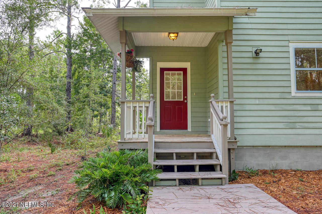 7001 Catlett Road St. Augustine, FL 32095 - Photo 6 of 46 a front view of a house with a yard