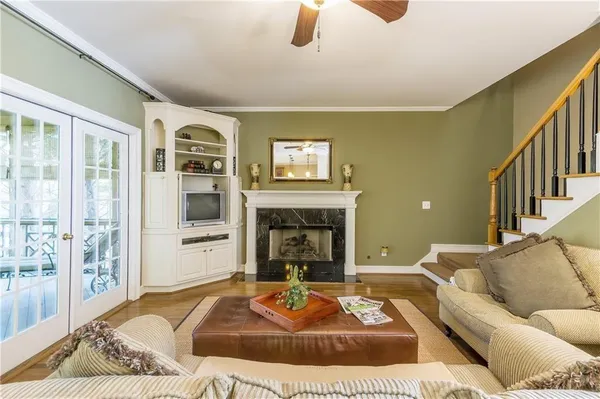 a living room with furniture and a fireplace
