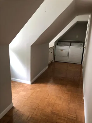 a view of a kitchen with white cabinets