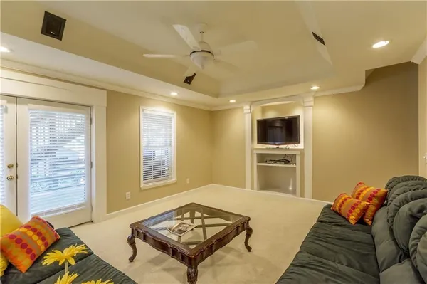 a bedroom with a bed and a couch