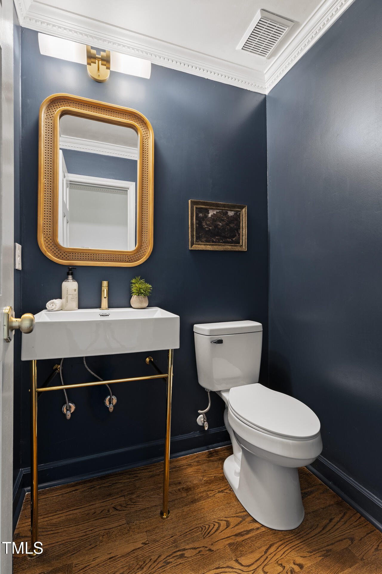 16 Cedar Hill Drive Durham, NC 27713 - Photo 11 of 35 a bathroom with a toilet a sink and mirror