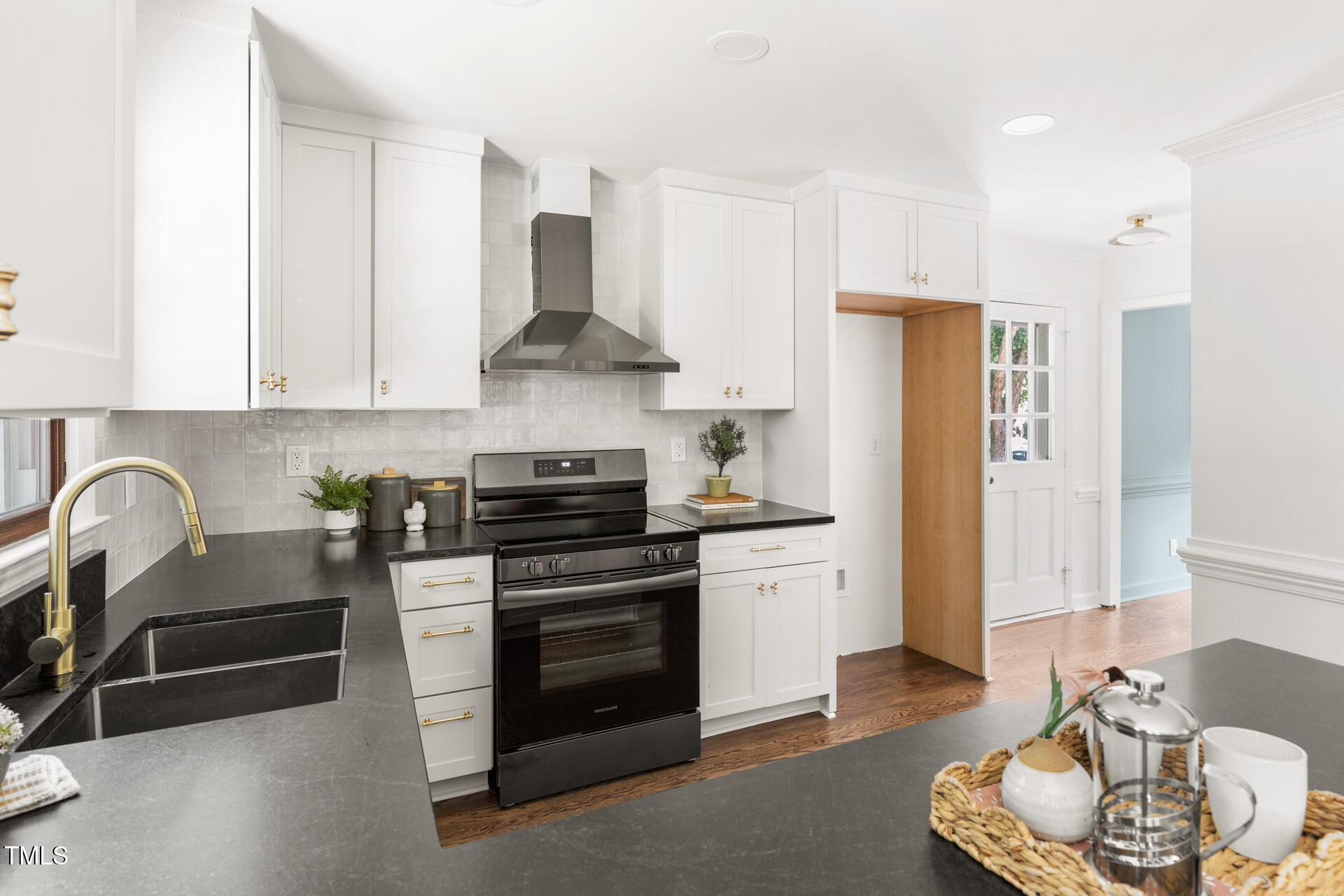 16 Cedar Hill Drive Durham, NC 27713 - Photo 21 of 35 a kitchen with stainless steel appliances a stove a sink and a refrigerator