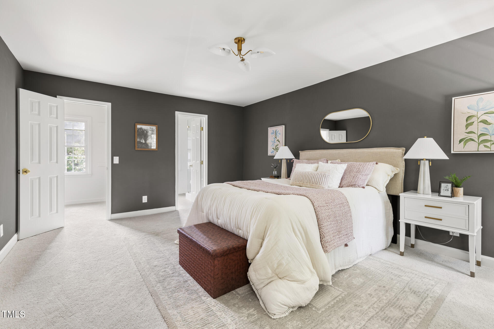 16 Cedar Hill Drive Durham, NC 27713 - Photo 23 of 35 a bedroom with a bed and a chandelier