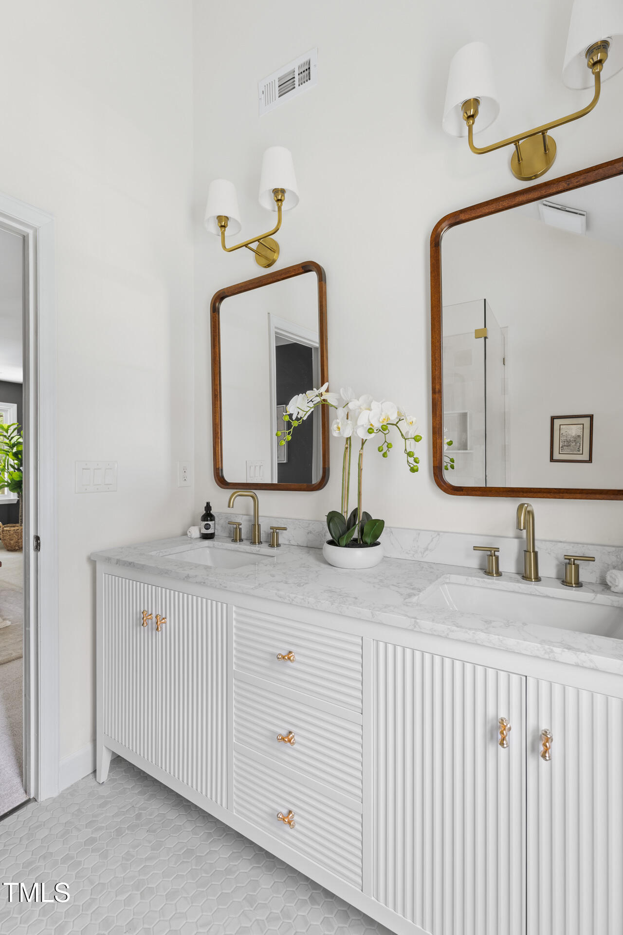 16 Cedar Hill Drive Durham, NC 27713 - Photo 26 of 35 a bathroom with a double vanity sink and a mirror