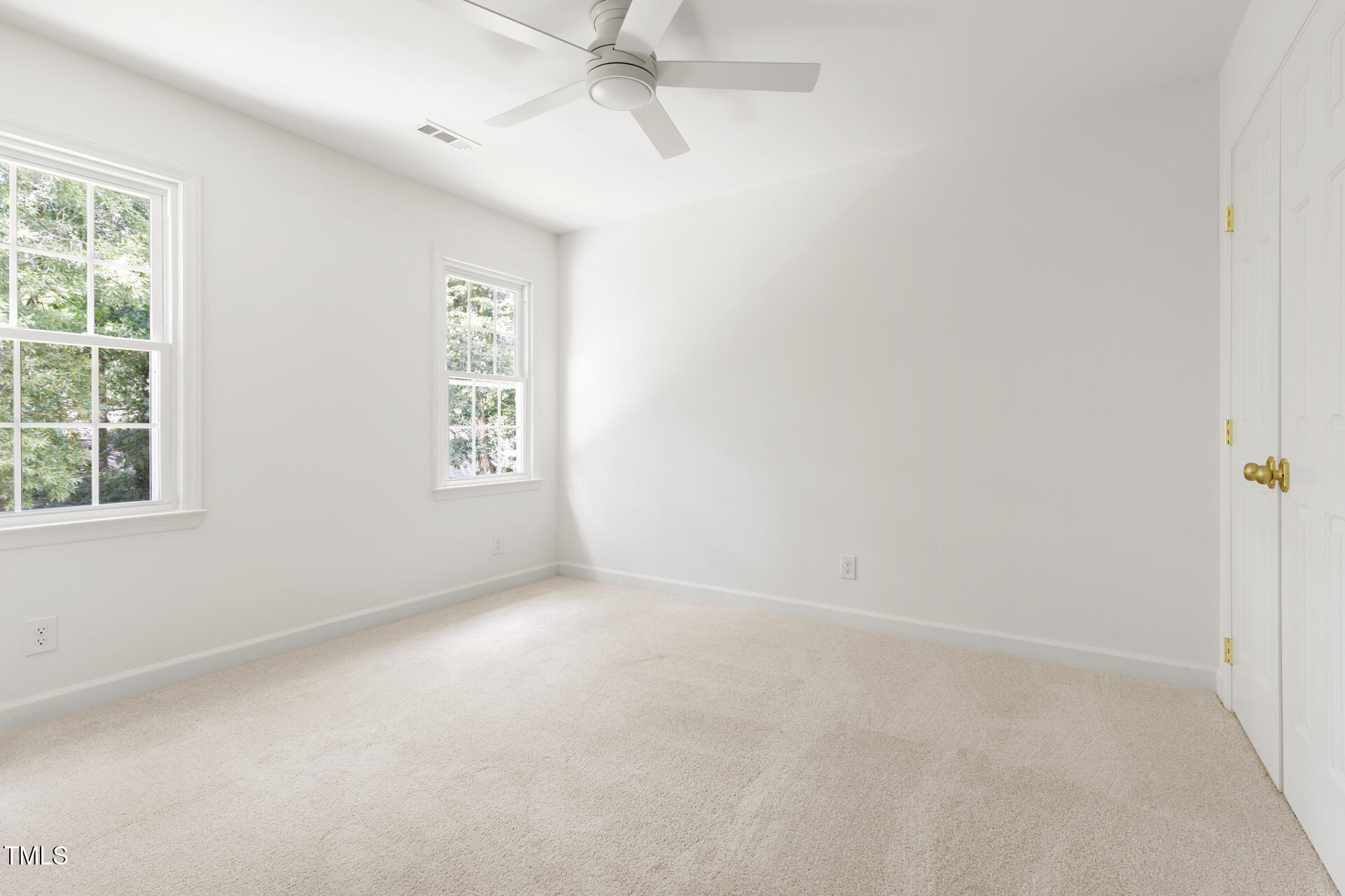 16 Cedar Hill Drive Durham, NC 27713 - Photo 31 of 35 an empty room with a window and a fan