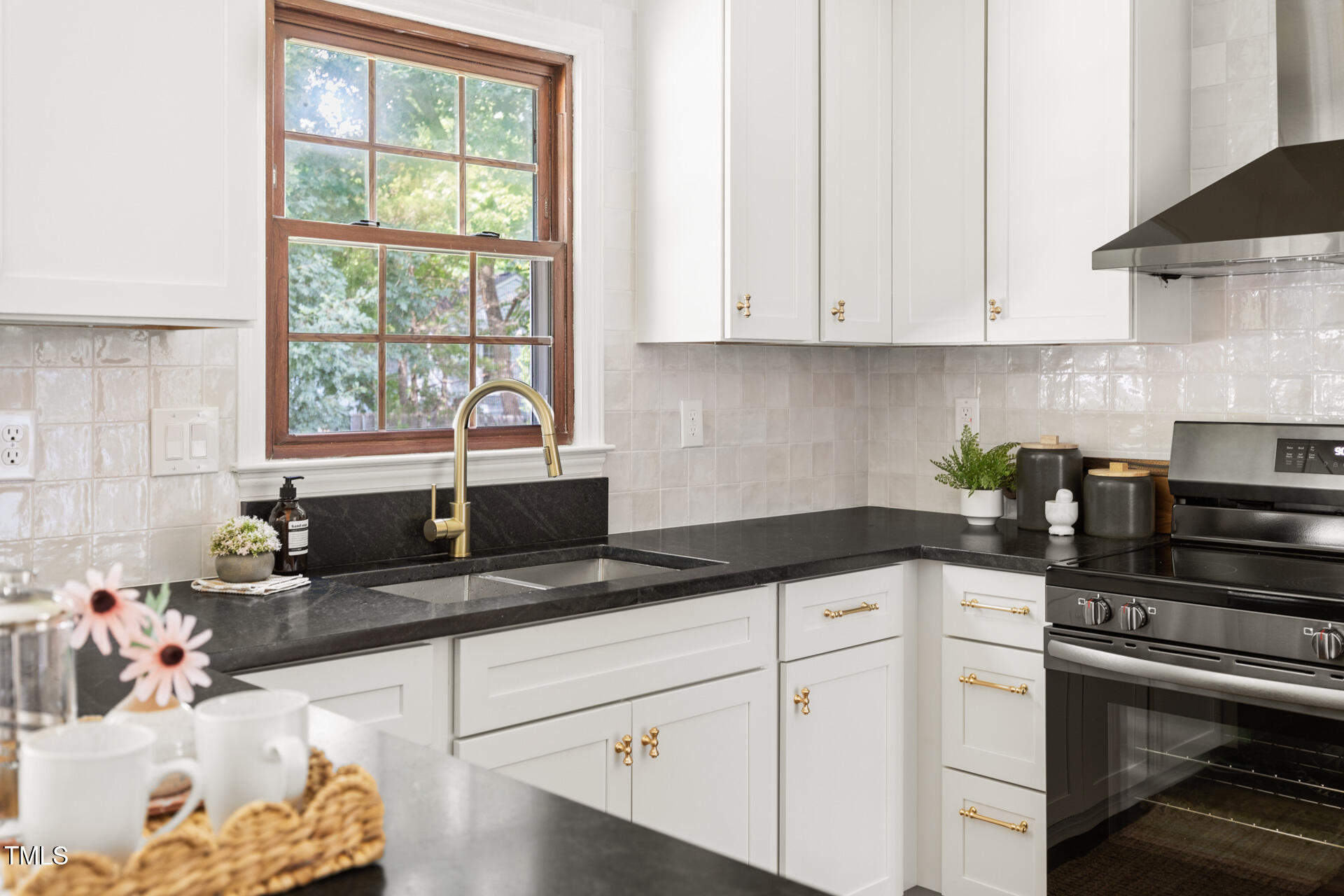 16 Cedar Hill Drive Durham, NC 27713 - Photo 6 of 35 a kitchen with granite countertop white cabinets and white appliances
