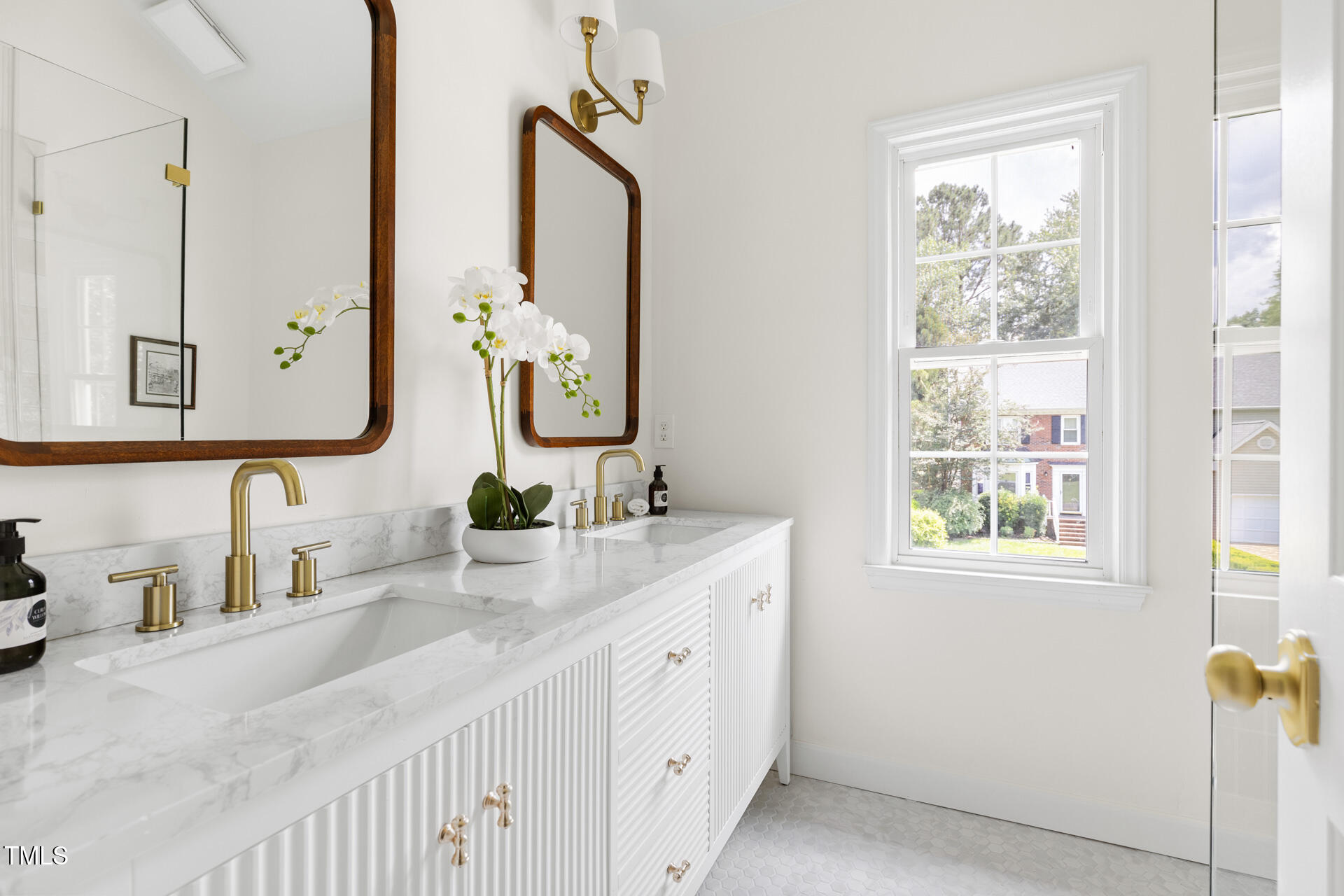 16 Cedar Hill Drive Durham, NC 27713 - Photo 9 of 35 a bathroom with double vanity and a mirror