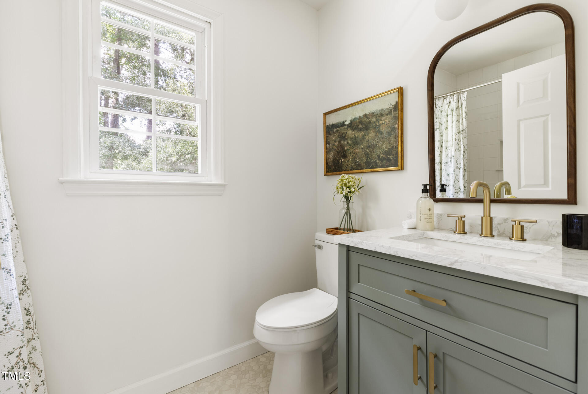 16 Cedar Hill Drive Durham, NC 27713 - Photo 10 of 35 a bathroom with a toilet a sink and mirror