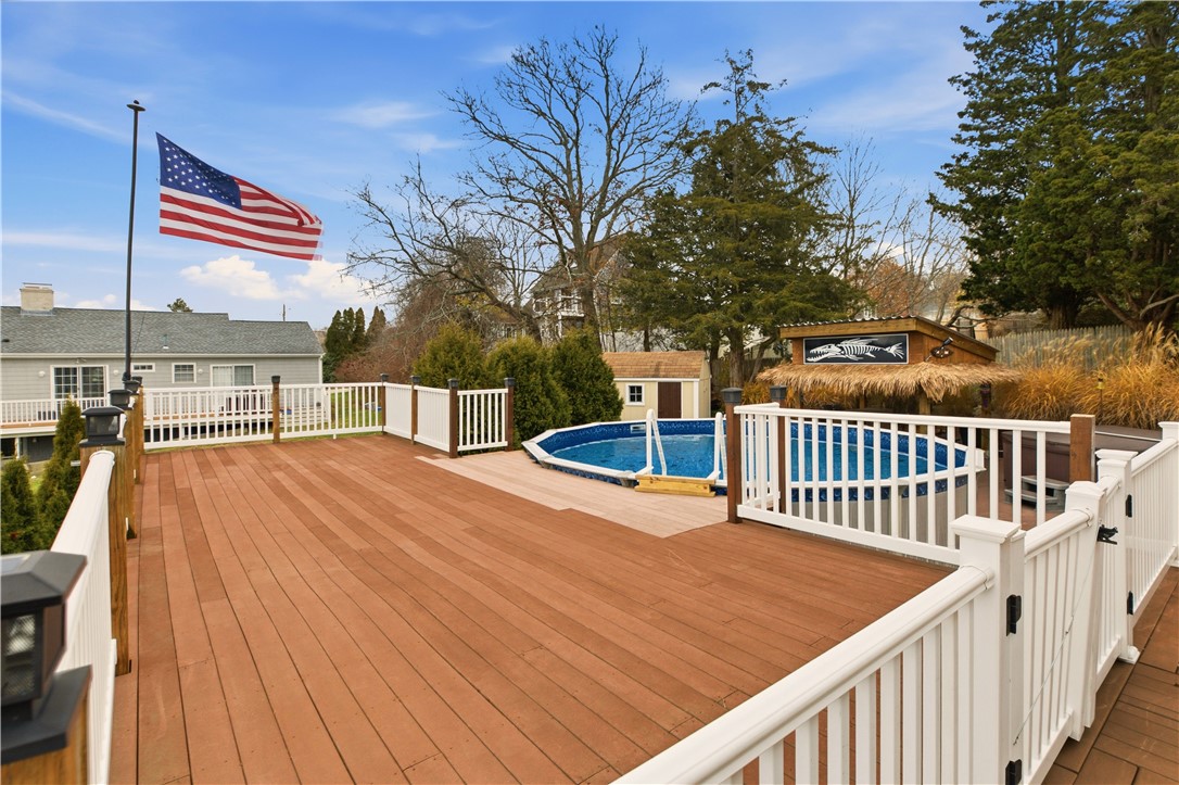 42 Lewis Street Tiverton, RI 02878 - Photo 40 of 50 Large Deck Overlooking Above Ground Pool and Patio