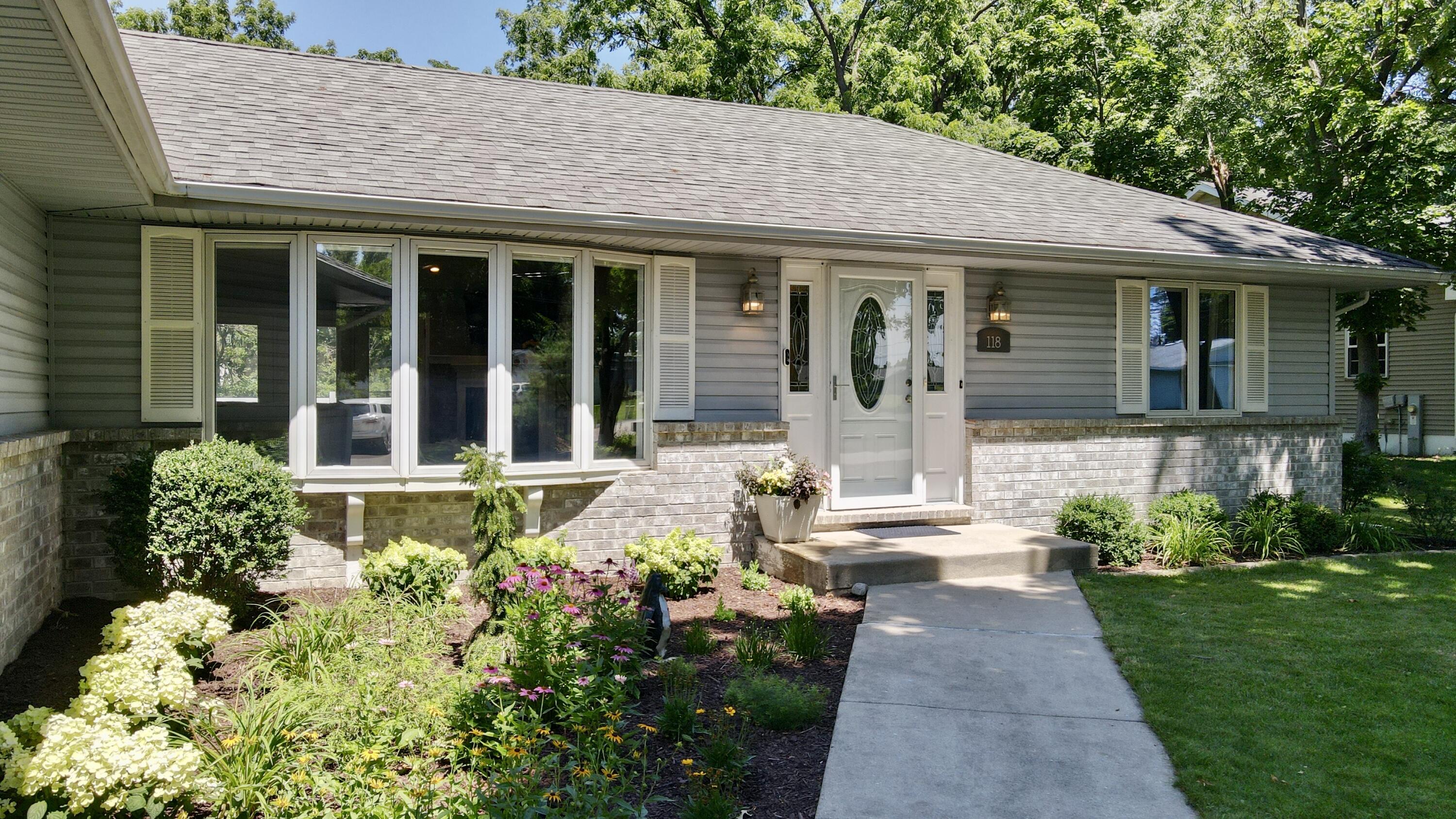 118 Hillview Road Williams Bay, WI 53191 - Photo 3 of 55 Take in the beautifully landscaped garden beds as you enter.