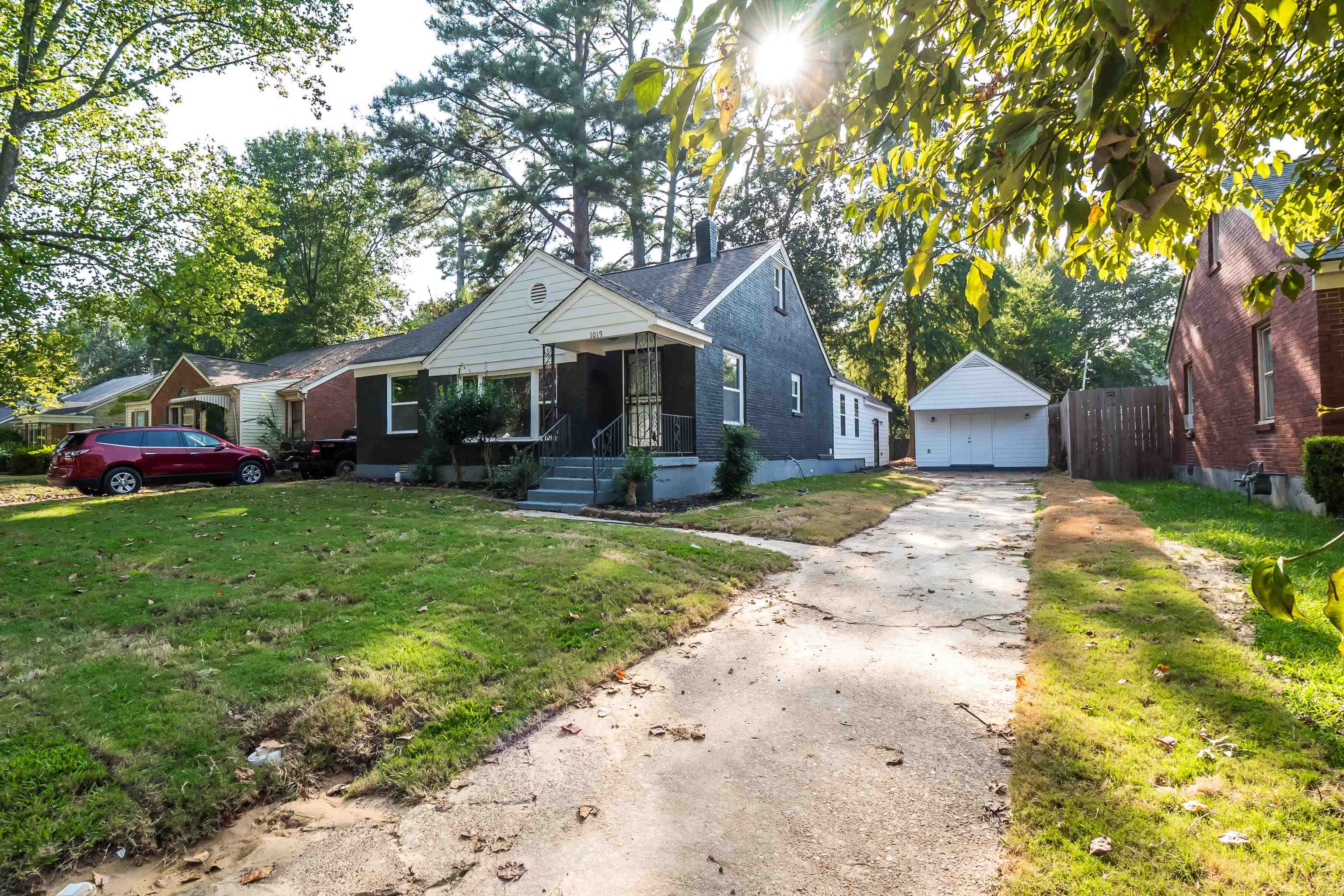 1019 Wingfield Road Memphis, TN 38122 - Photo 1 of 34 a front view of a house with a yard and garage