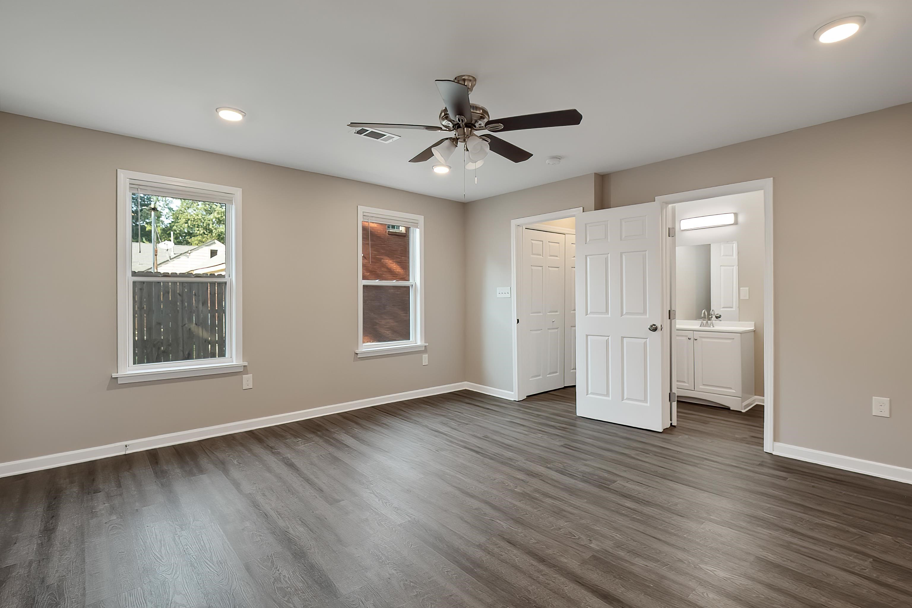 1019 Wingfield Road Memphis, TN 38122 - Photo 20 of 34 a view of an empty room with wooden floor and a window