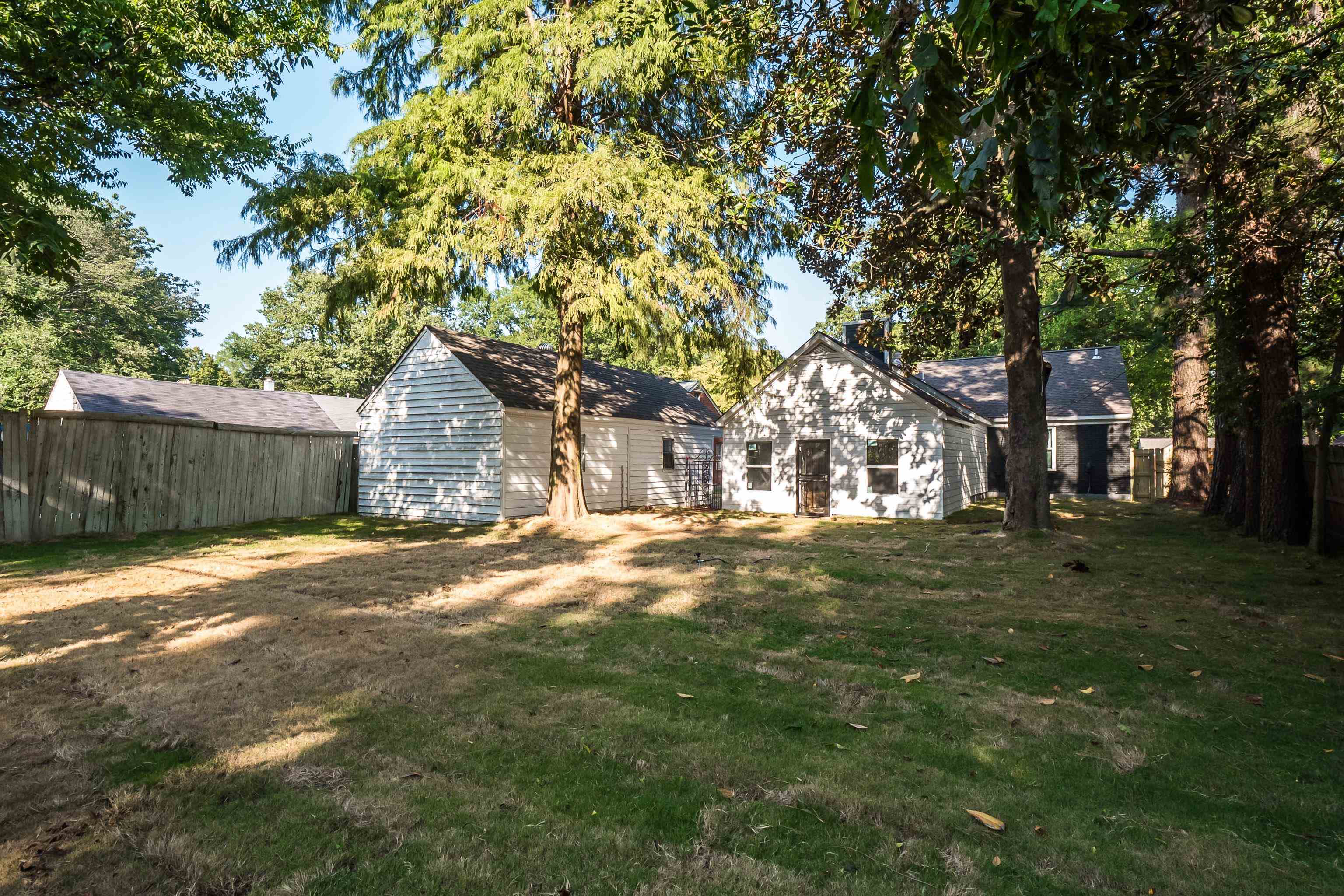 1019 Wingfield Road Memphis, TN 38122 - Photo 29 of 34 a view of a yard in front of a house with large trees