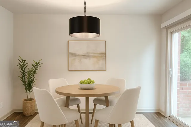 a view of a dining room with furniture window and wooden floor