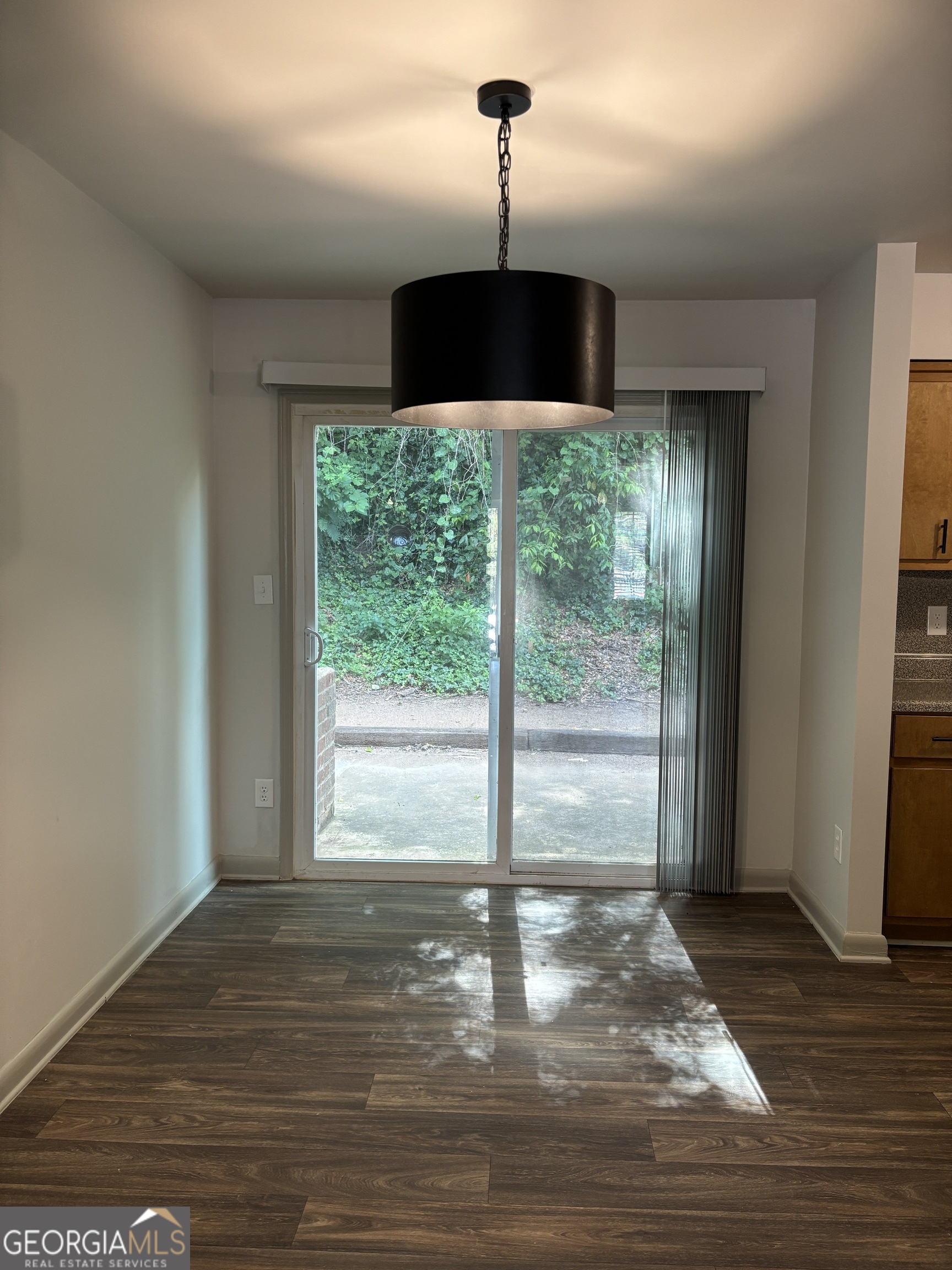 1609 Line Street Decatur, GA 30032 - Photo 8 of 15 a view of an empty room with wooden floor and a window