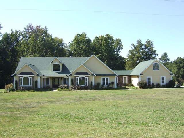 2410 High Falls Road Jackson, GA 30233 - Photo 1 of 1 a front view of a house with a yard