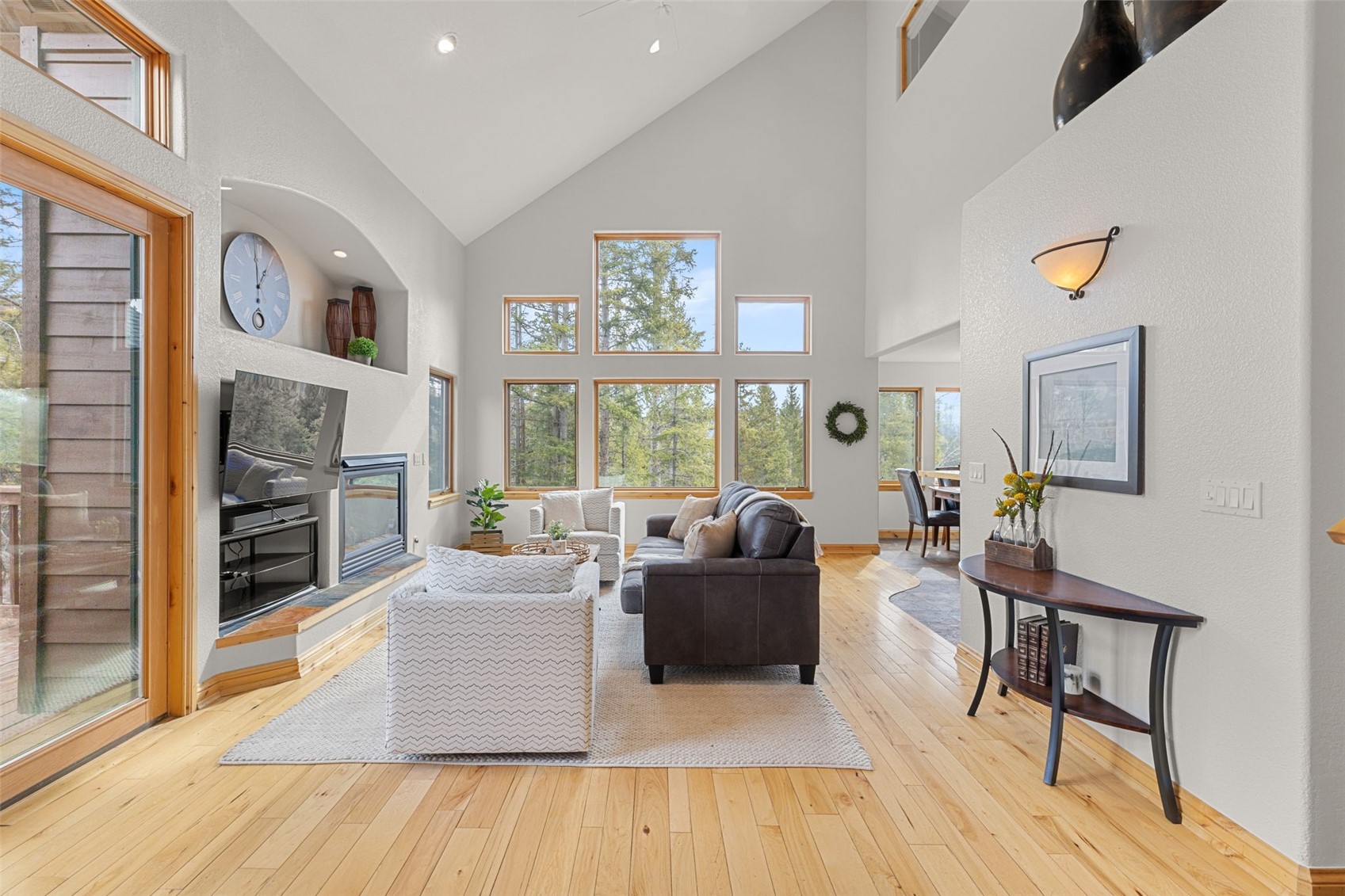 91795 Ryan Gulch Road Silverthorne, CO 80498 - Photo 12 of 50 a living room with fireplace furniture and a large window