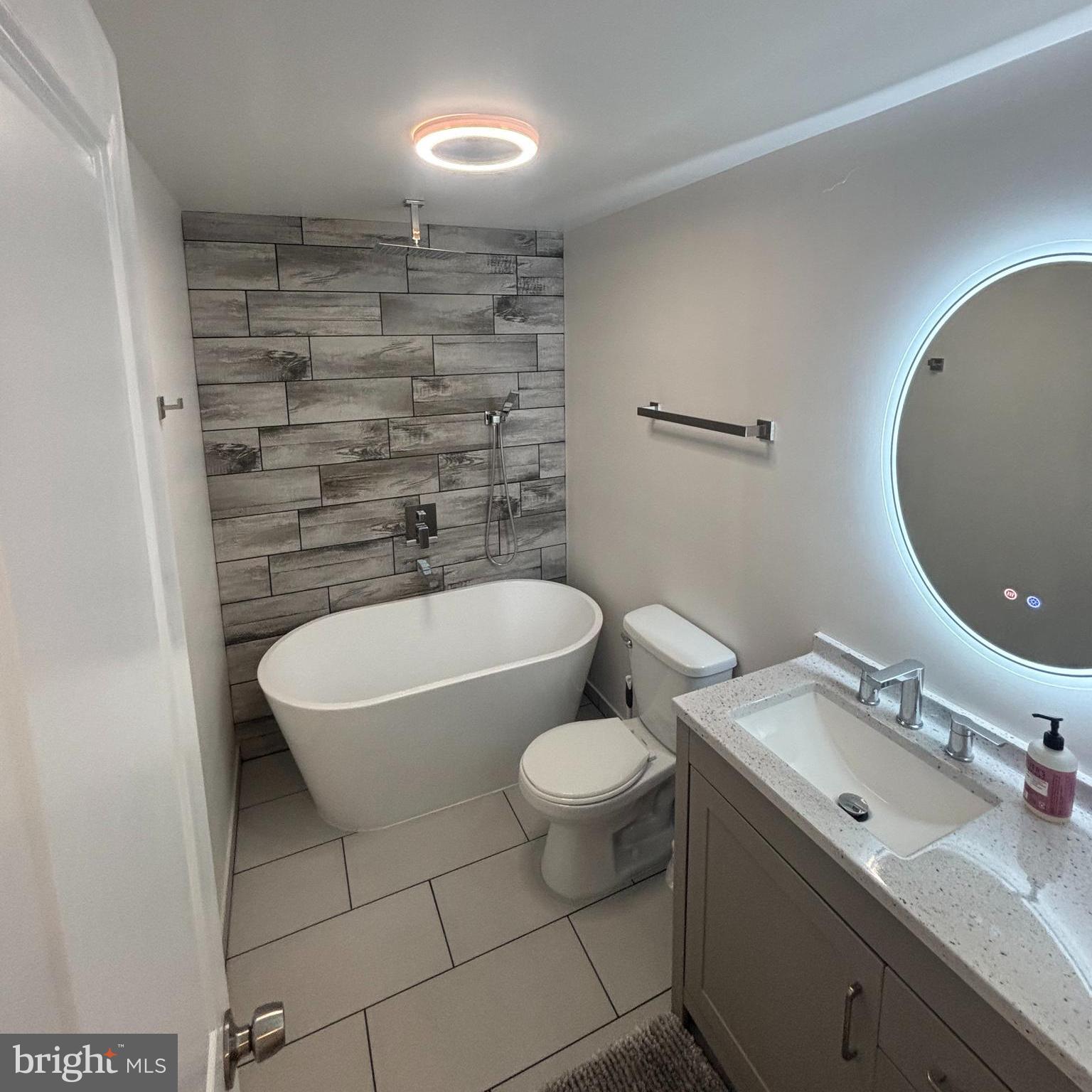 31752 Siham Road Lewes, DE 19958 - Photo 16 of 18 a bathroom with a sink and a mirror