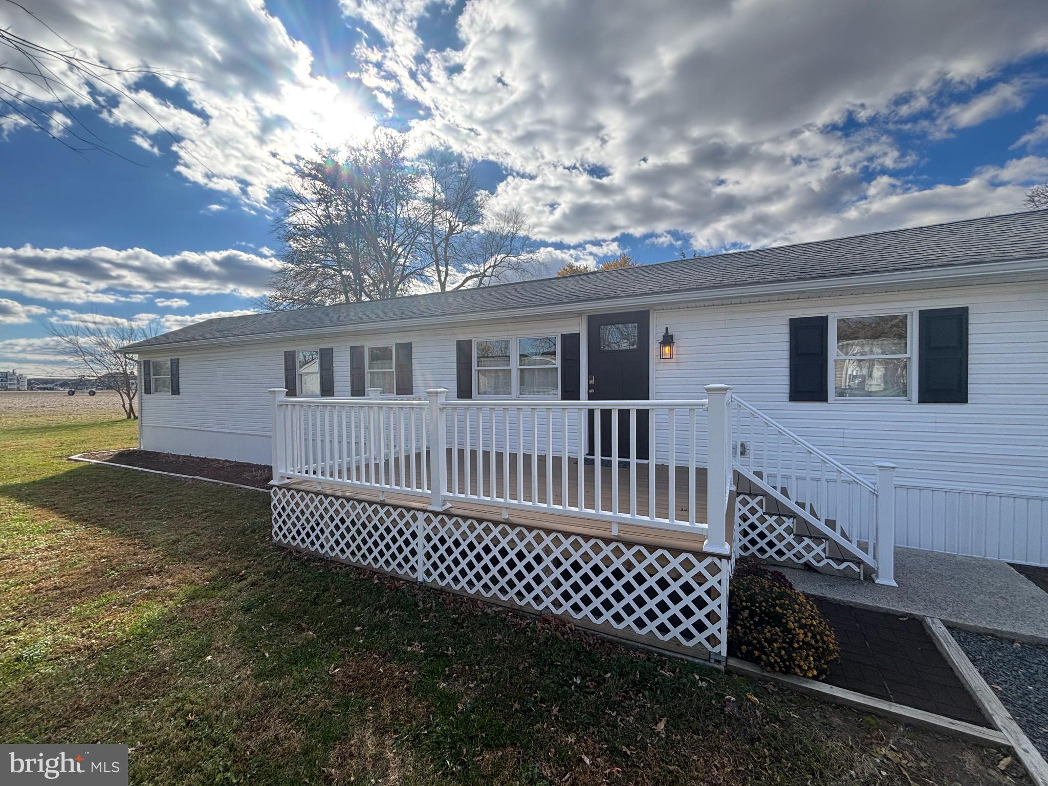 31752 Siham Road Lewes, DE 19958 - Photo 3 of 18 a view of a house with a deck