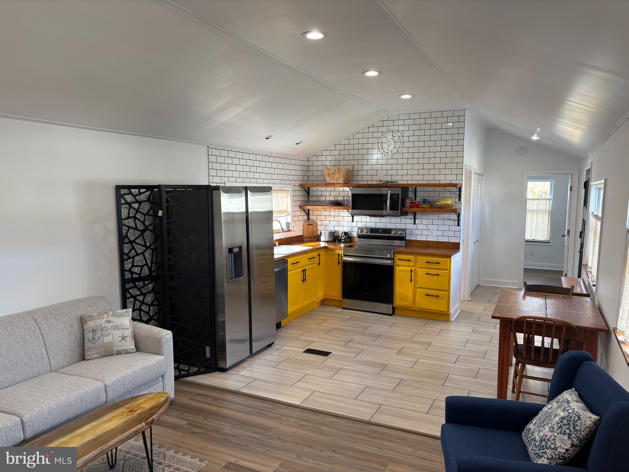 31752 Siham Road Lewes, DE 19958 - Photo 10 of 18 a living room with stainless steel appliances furniture and a kitchen view