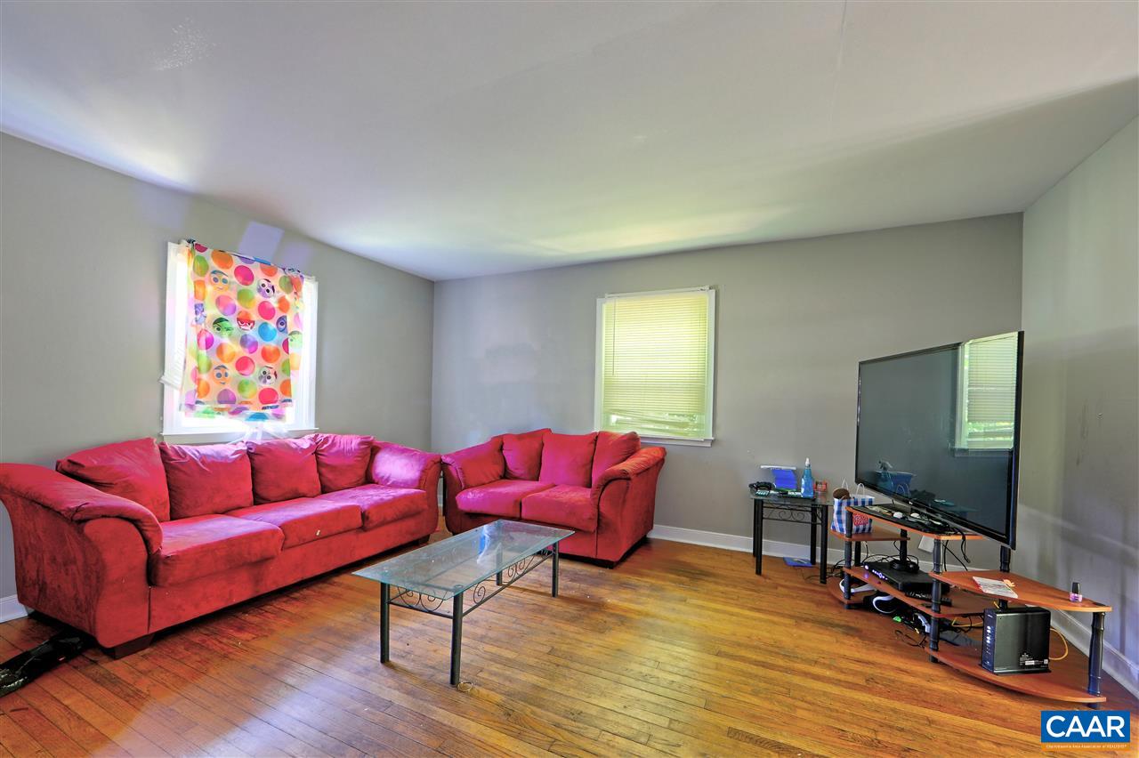 2208 North Berkshire Road, Unit A Charlottesville, VA 22901 - Photo 5 of 6 a living room with furniture and a flat screen tv