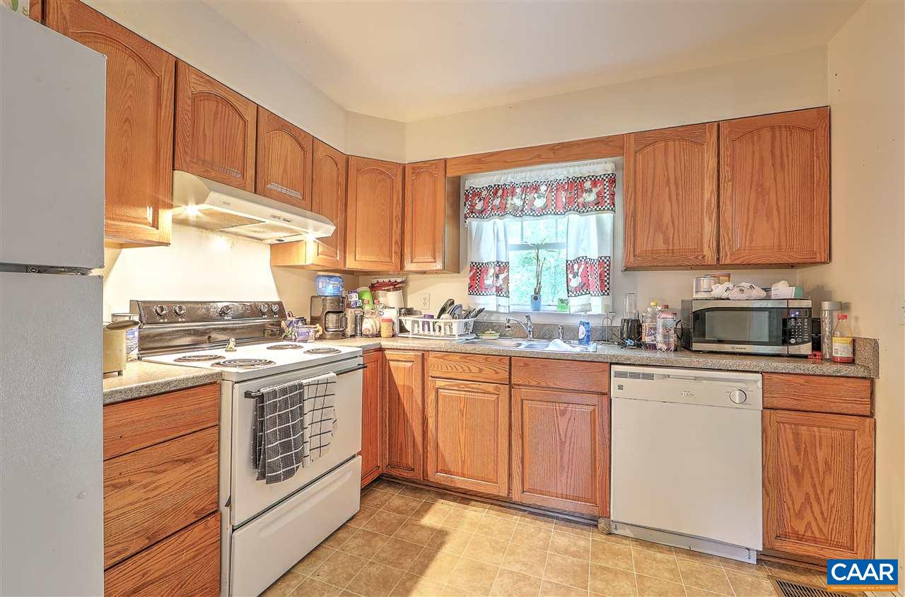 2208 North Berkshire Road, Unit A Charlottesville, VA 22901 - Photo 6 of 6 a kitchen with a sink stove and cabinets