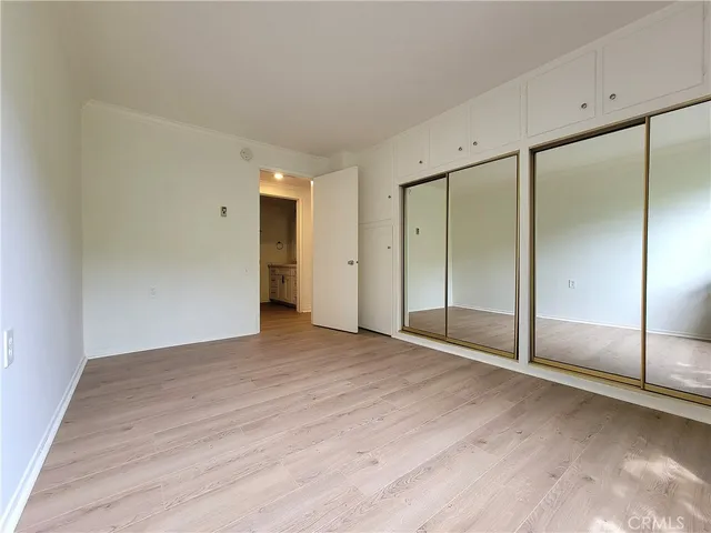 a bathroom with a double vanity sink a mirror and shower