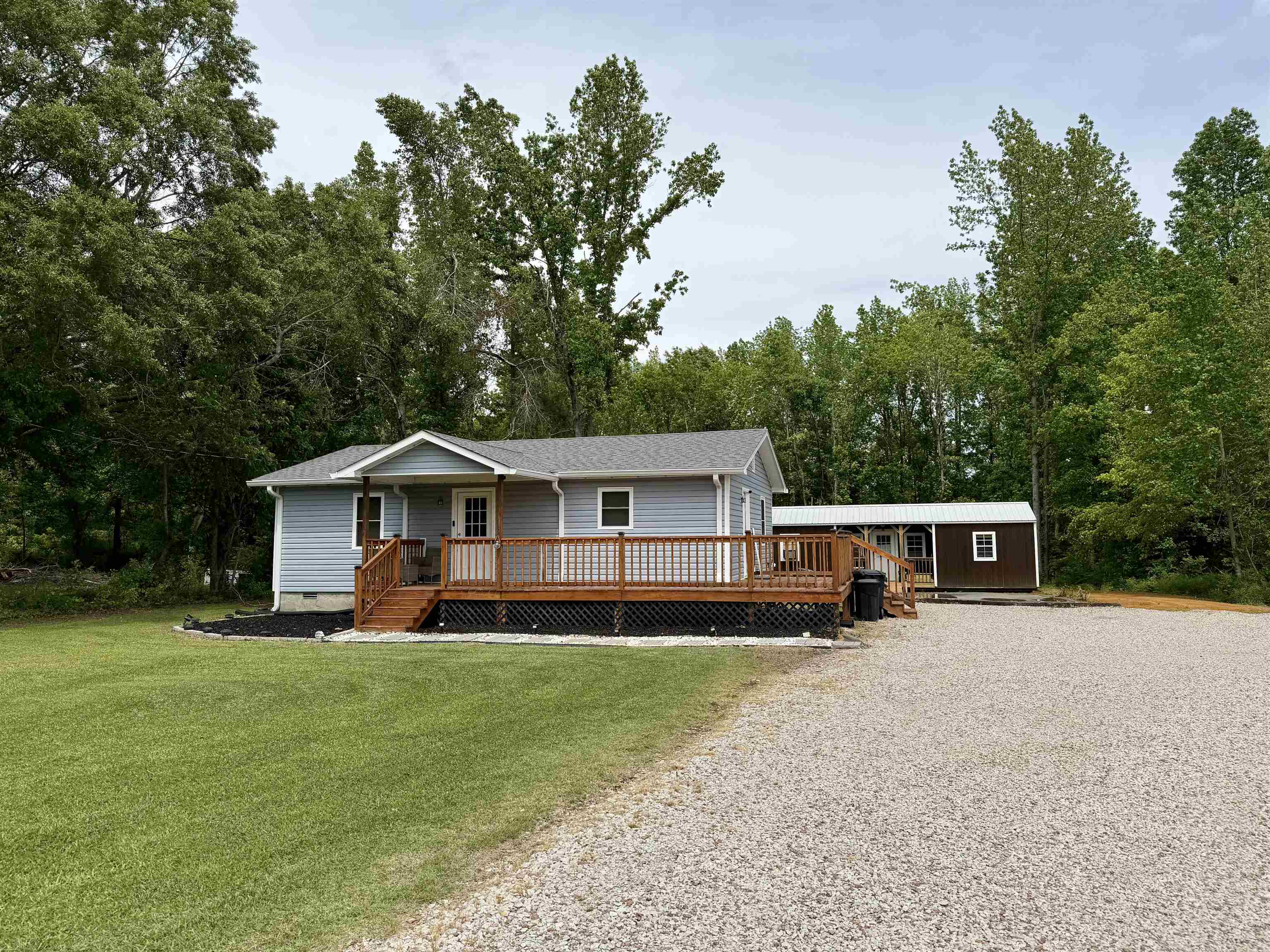 8022 45th Highway Ramer, TN 38367 - Photo 16 of 20 a front view of a house with a yard and trees