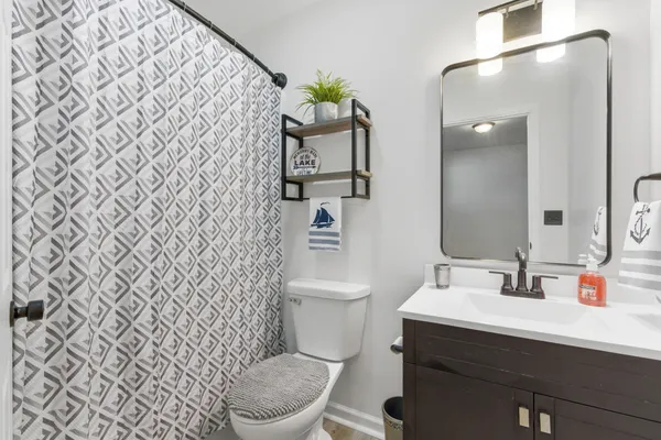 a bathroom with a toilet and a sink