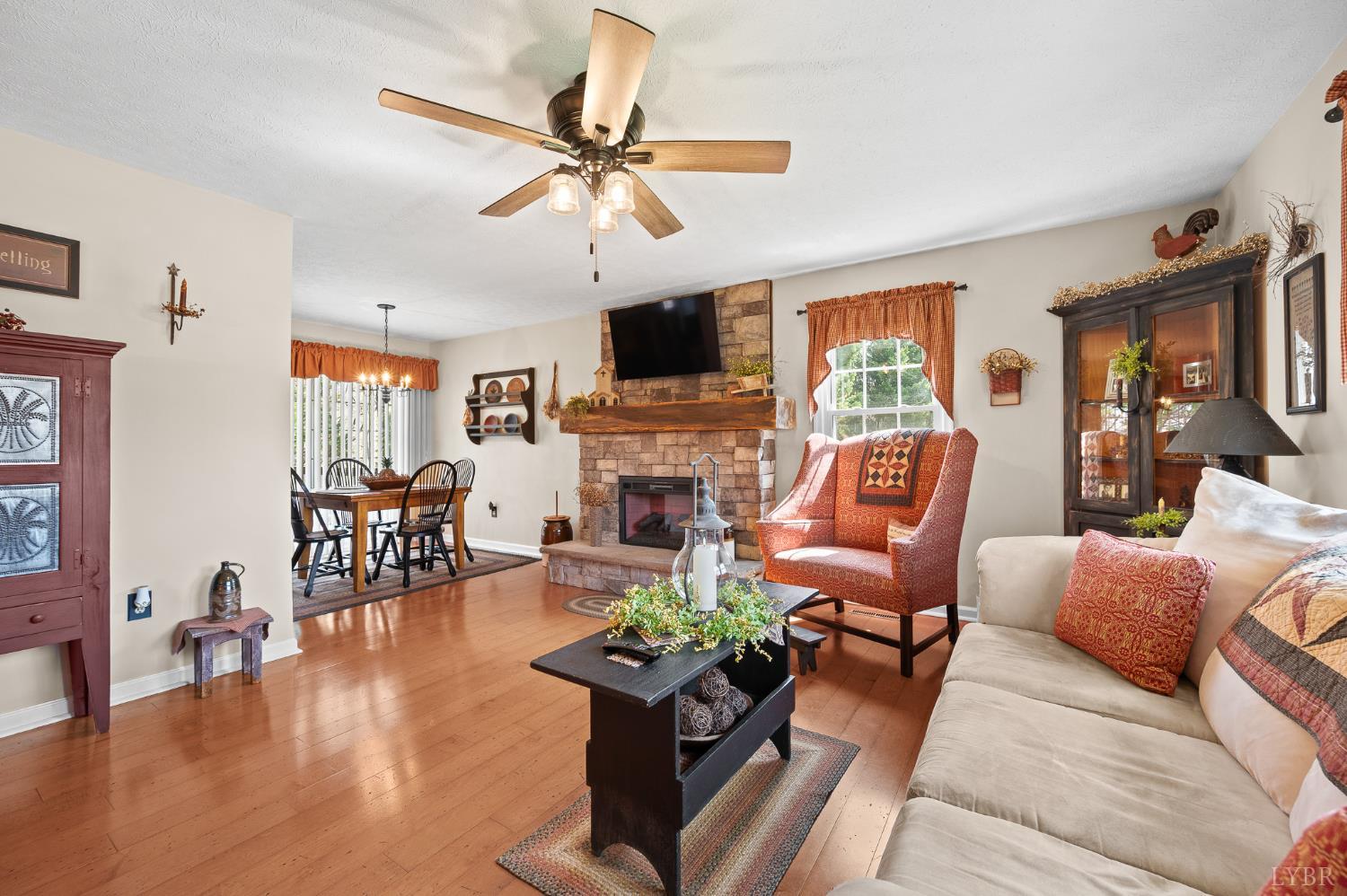 1136 Coolbrook Road Bedford, VA 24523 - Photo 11 of 46 a living room with furniture fireplace and a flat screen tv