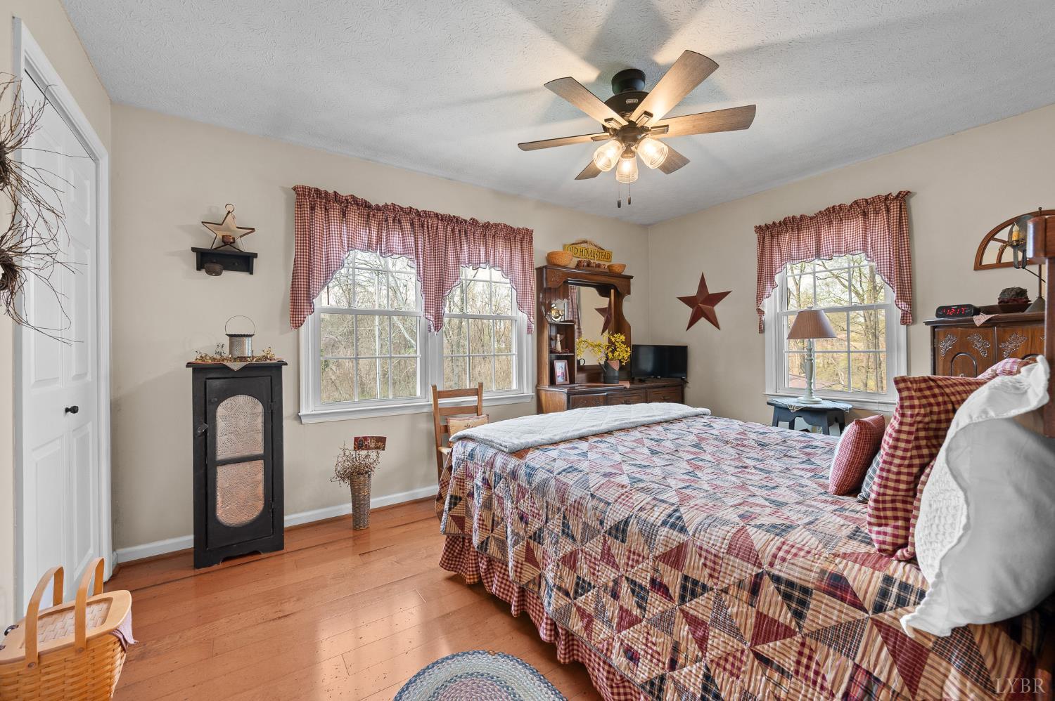 1136 Coolbrook Road Bedford, VA 24523 - Photo 20 of 46 a bedroom with a bed and a chandelier