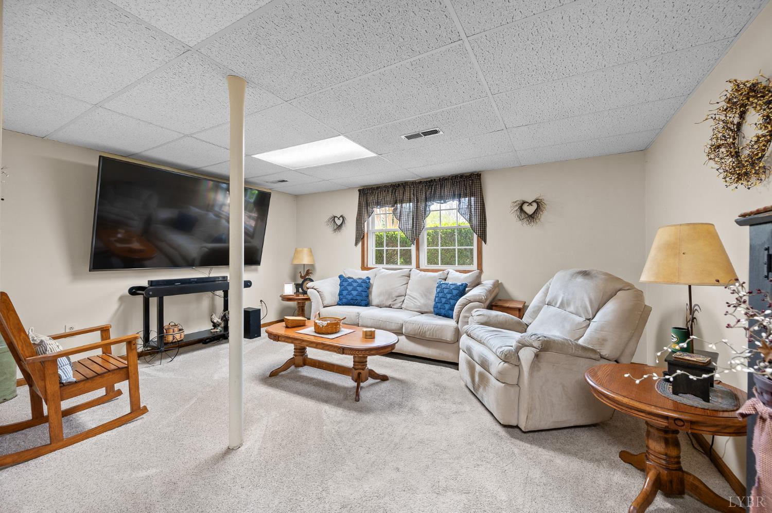 1136 Coolbrook Road Bedford, VA 24523 - Photo 23 of 46 a living room with furniture and a flat screen tv