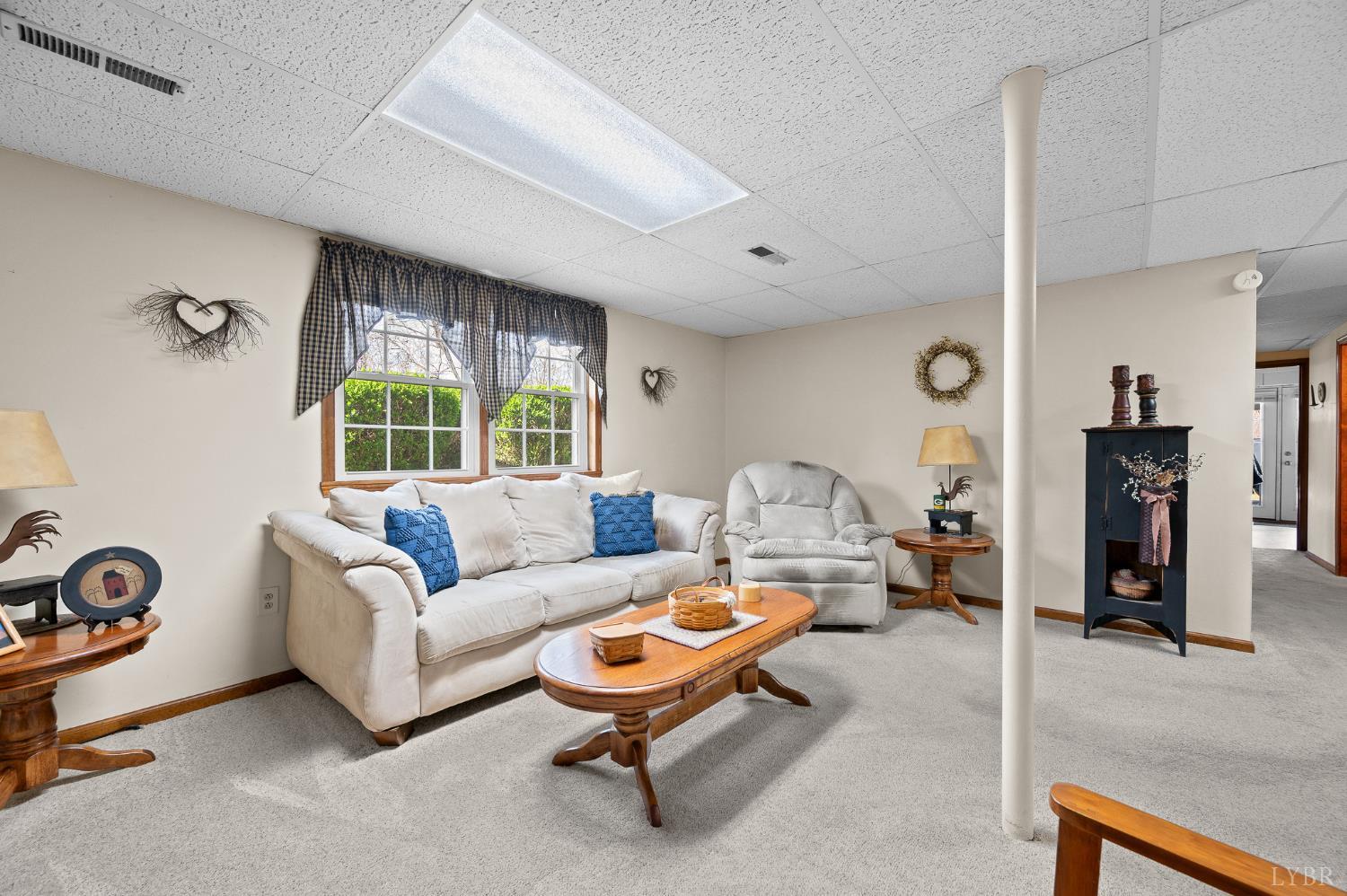 1136 Coolbrook Road Bedford, VA 24523 - Photo 24 of 46 a living room with furniture and a large window