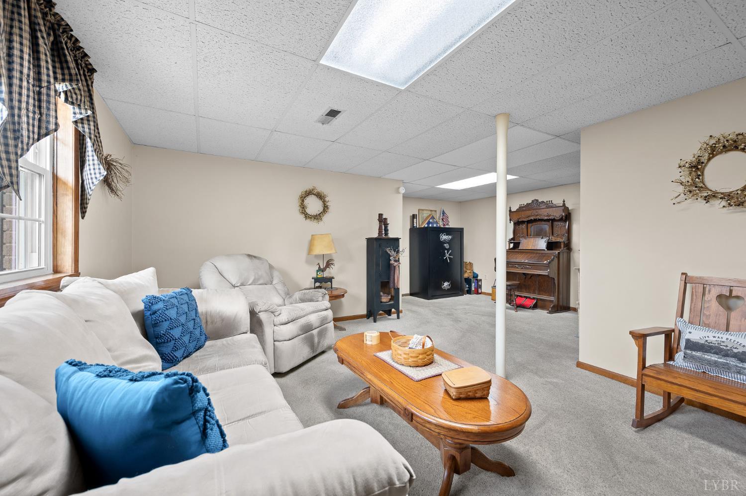 1136 Coolbrook Road Bedford, VA 24523 - Photo 25 of 46 a living room with furniture and a fireplace