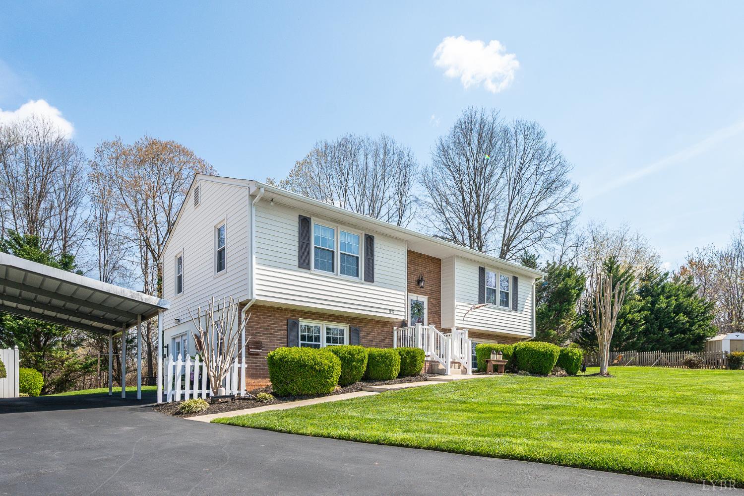 1136 Coolbrook Road Bedford, VA 24523 - Photo 3 of 46 a front view of a house with a garden and plants