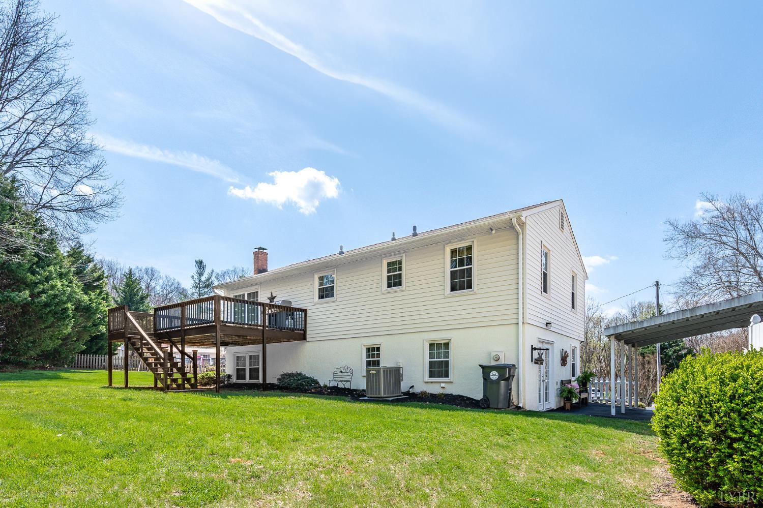 1136 Coolbrook Road Bedford, VA 24523 - Photo 35 of 46 a view of a house with a big yard and large trees