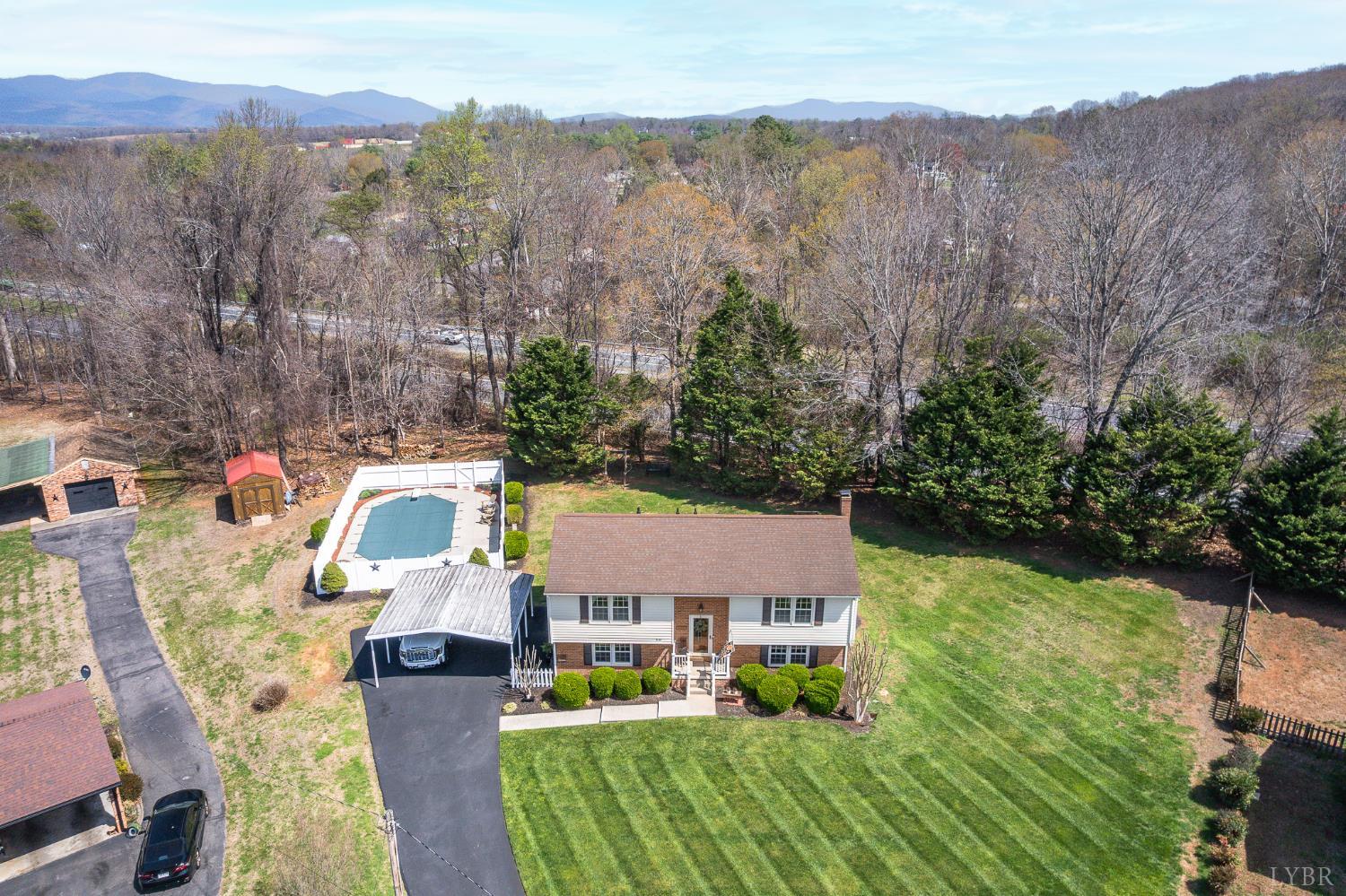 1136 Coolbrook Road Bedford, VA 24523 - Photo 4 of 46 an aerial view of a house with yard swimming pool and mountain view