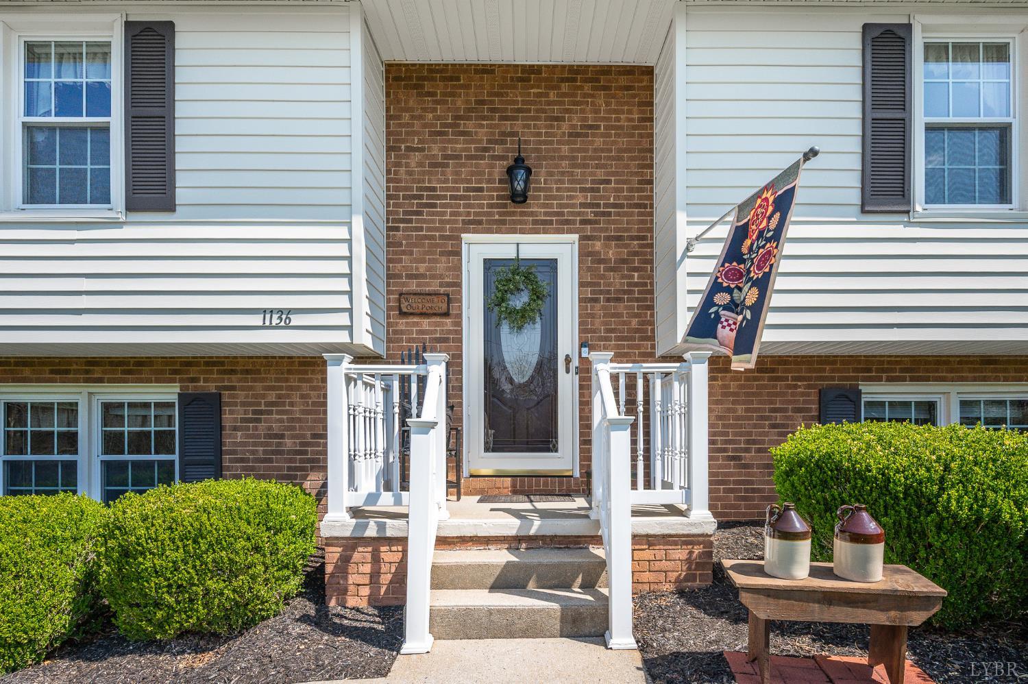 1136 Coolbrook Road Bedford, VA 24523 - Photo 6 of 46 a front view of a house with a yard