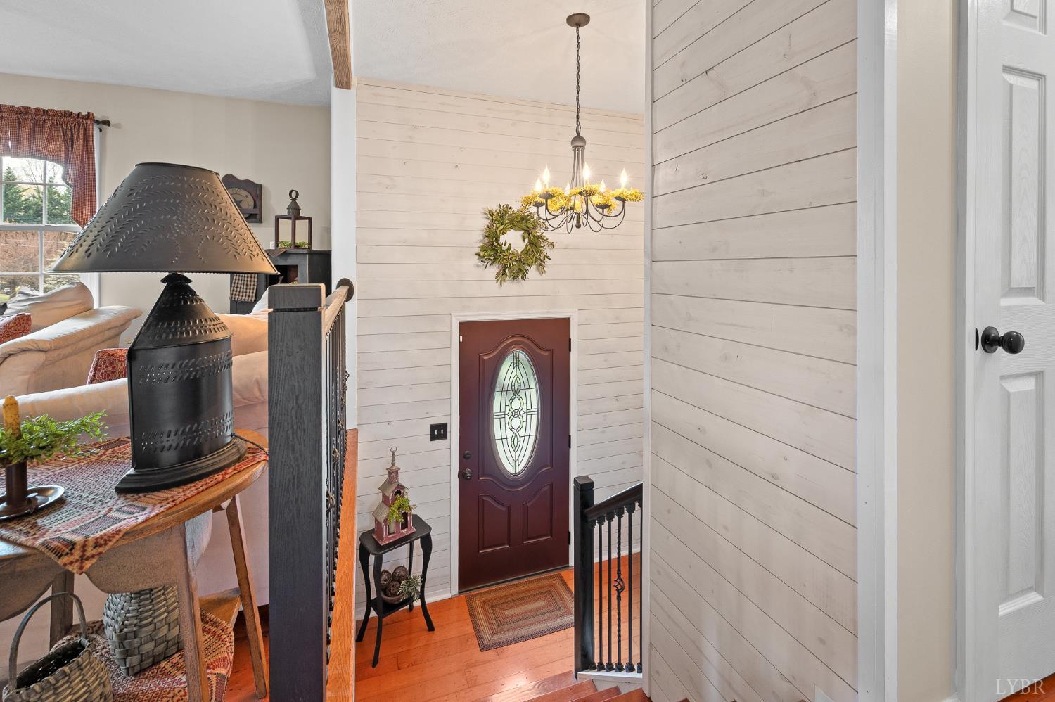 1136 Coolbrook Road Bedford, VA 24523 - Photo 7 of 46 a view of a hallway with wooden floor and furniture
