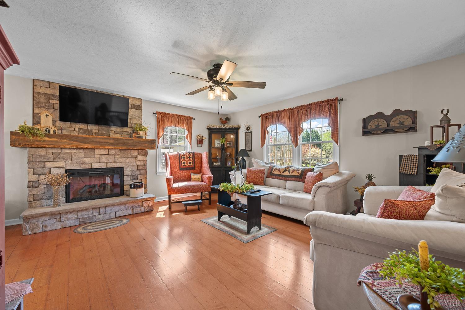 1136 Coolbrook Road Bedford, VA 24523 - Photo 8 of 46 a living room with furniture fireplace and flat screen tv