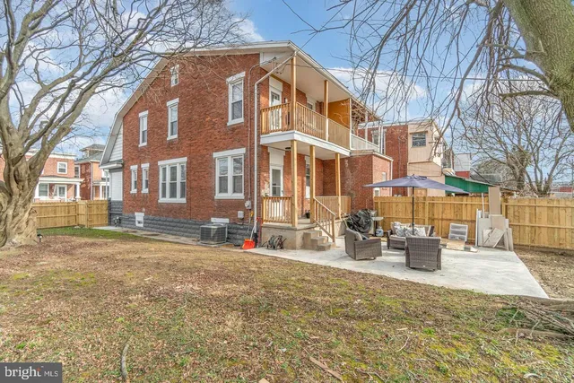 a view of a building with large trees