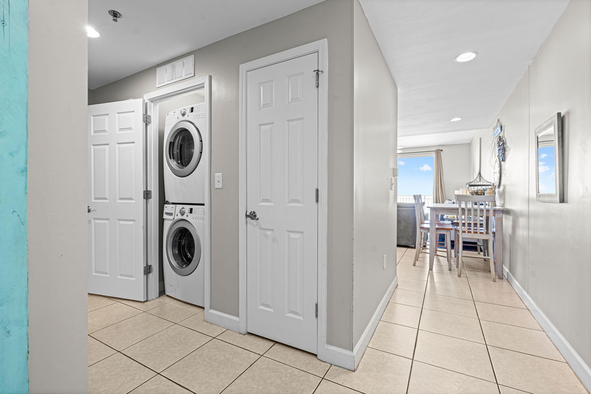 17729 Front Beach Road, Unit 702E Panama City Beach, FL 32413 - Photo 16 of 53 a view of a storage & utility room with washer and dryer