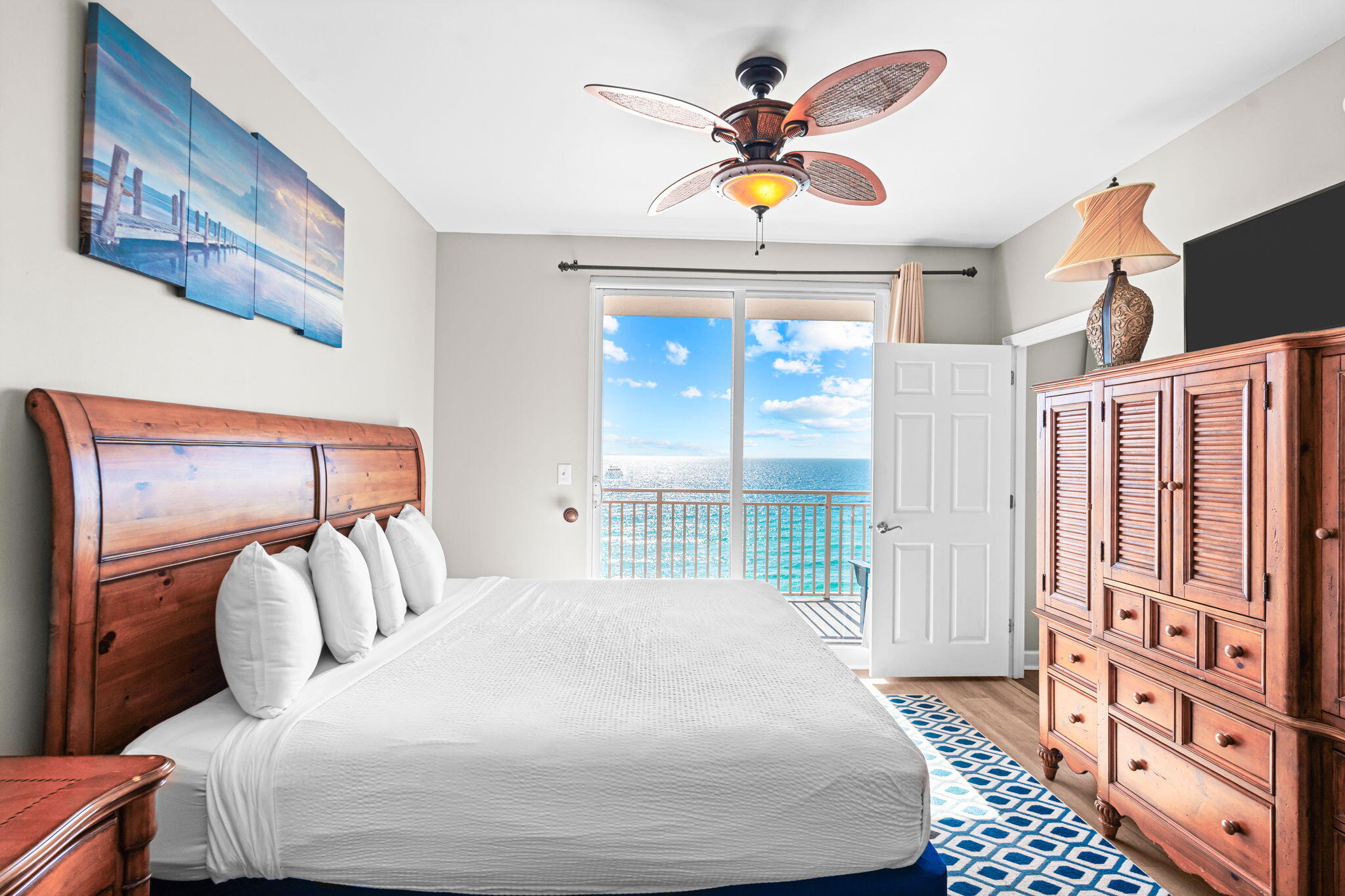 17729 Front Beach Road, Unit 702E Panama City Beach, FL 32413 - Photo 19 of 53 a bedroom with a bed and painting on the wall