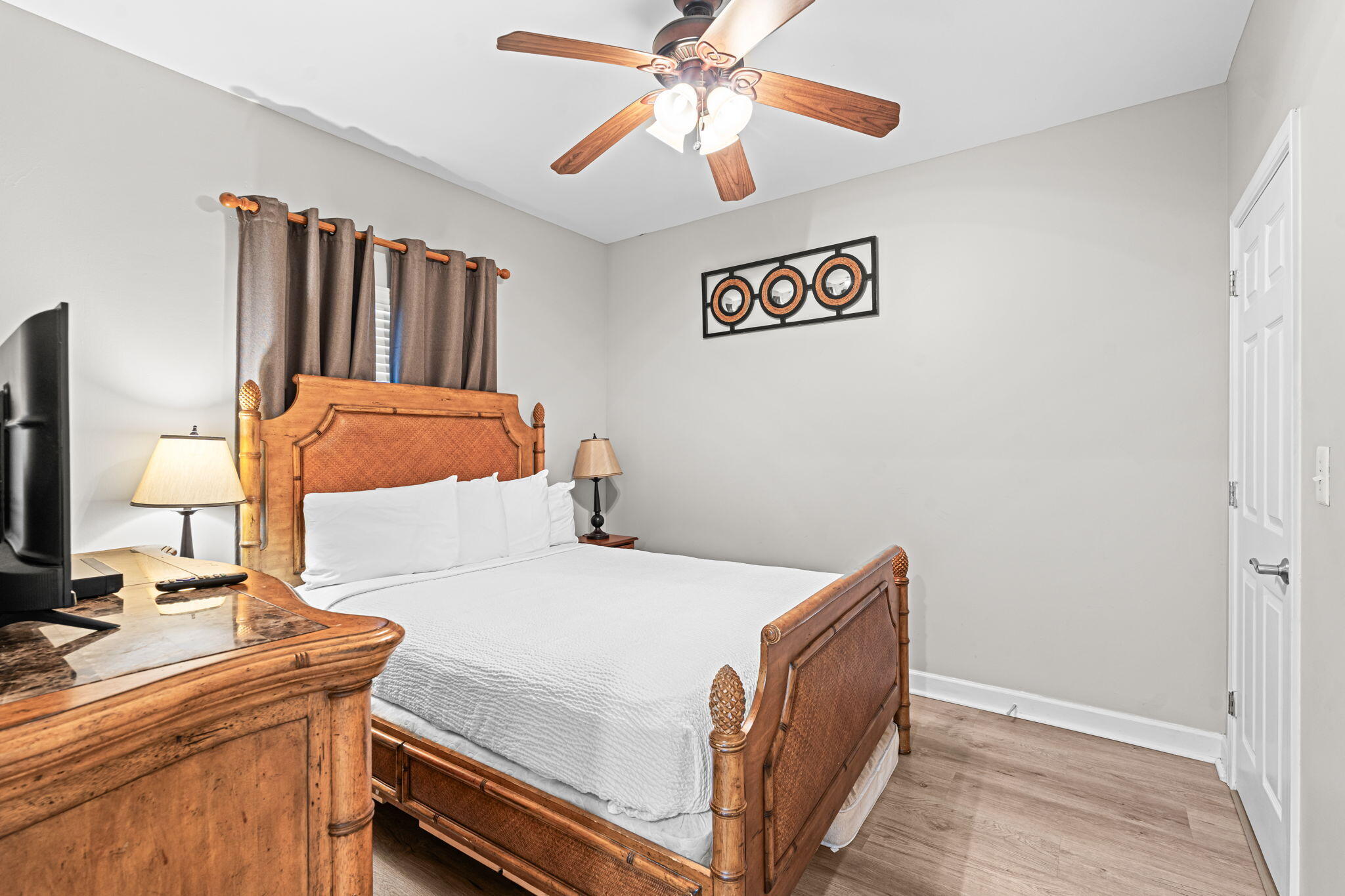 17729 Front Beach Road, Unit 702E Panama City Beach, FL 32413 - Photo 22 of 53 a bedroom with a bed and a chandelier