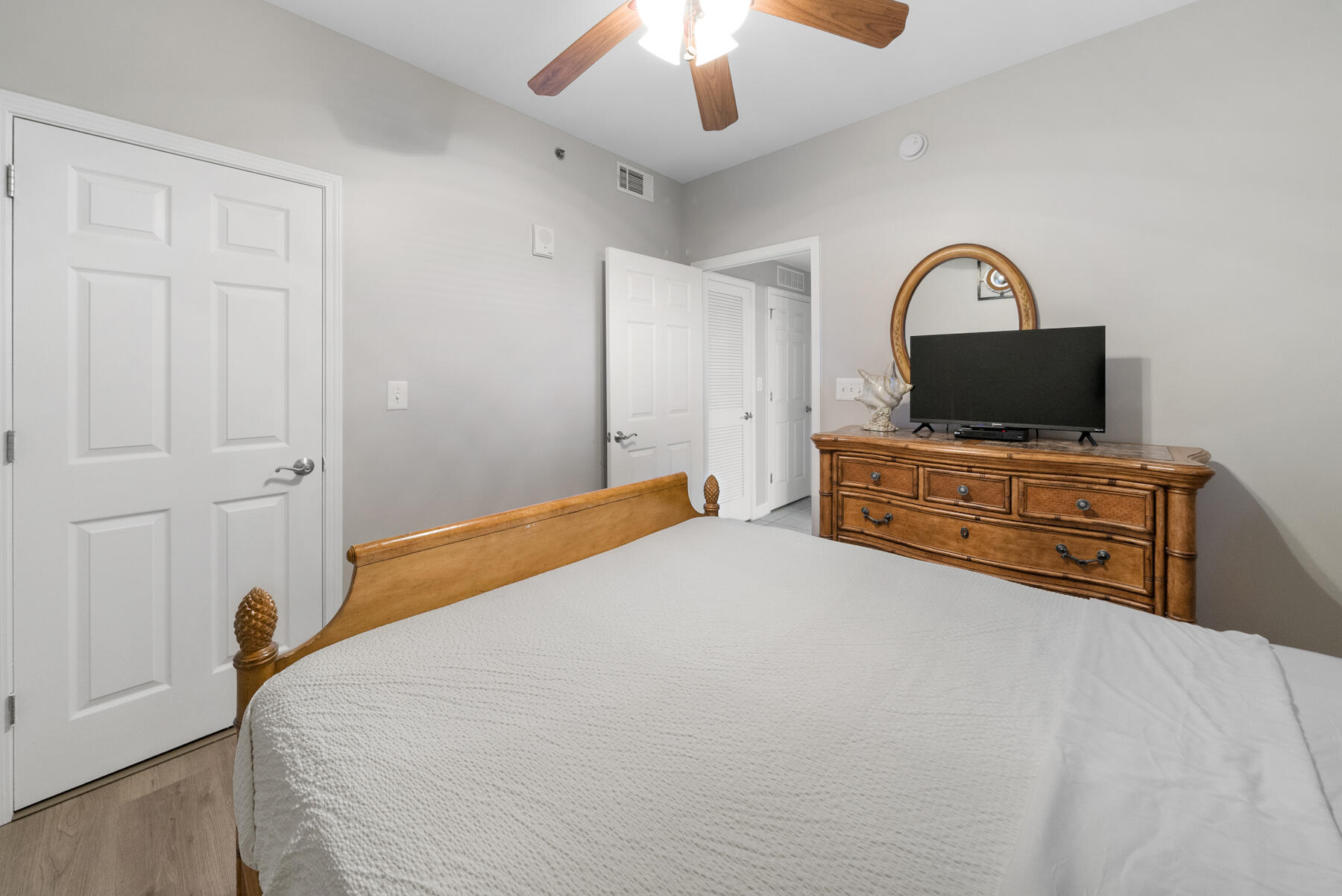 17729 Front Beach Road, Unit 702E Panama City Beach, FL 32413 - Photo 29 of 53 a bedroom with a bed and a television