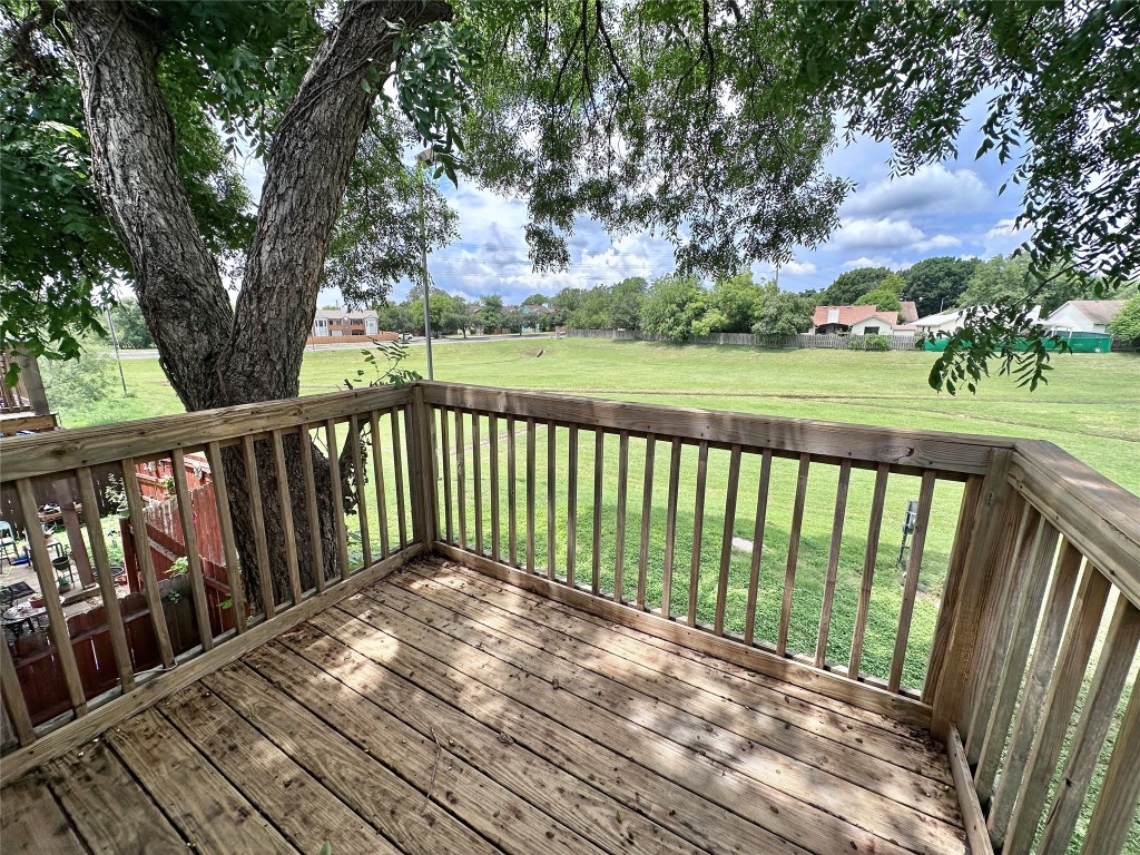 9808 Roxanna Drive, Unit D Austin, TX 78748 - Photo 10 of 12 a balcony with trees in front of it