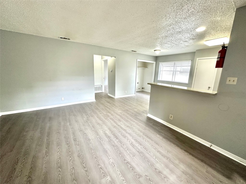 9808 Roxanna Drive, Unit D Austin, TX 78748 - Photo 4 of 12 a view of a room with wooden floor and window