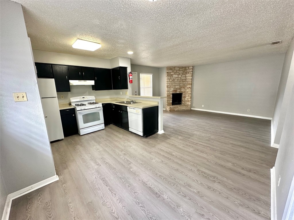 9808 Roxanna Drive, Unit D Austin, TX 78748 - Photo 12 of 12 a view of kitchen and kitchen with wooden floor