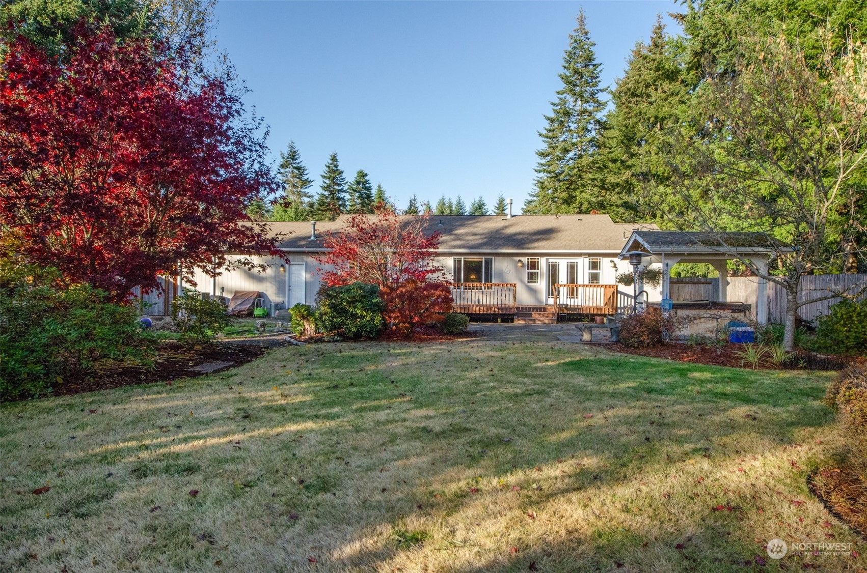 8203 177th Lane Southwest Rochester, WA 98579 - Photo 18 of 30 a view of a house with a yard